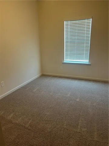 a view of a room that has a window in it