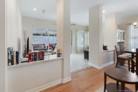 a view of a livingroom with furniture and a flat screen tv