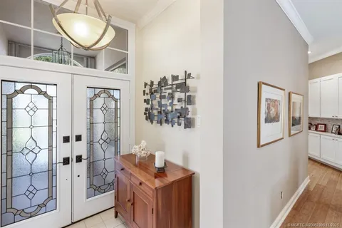 a view of an entryway with wooden floor