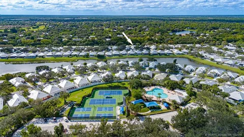 a view of a swimming pool with a yard