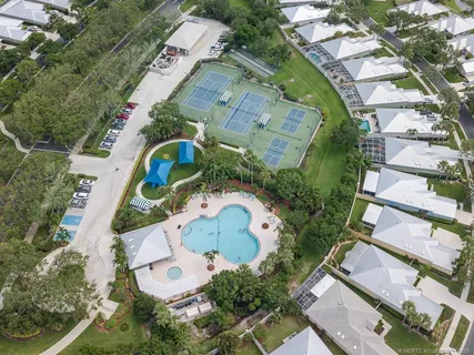 a view of a swimming pool with a yard