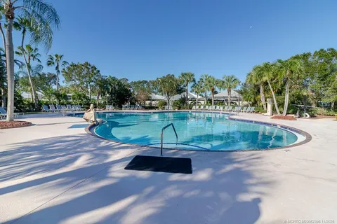 a view of a swimming pool with a yard