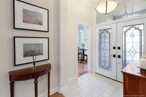 a kitchen with stainless steel appliances granite countertop a sink a stove counter space and cabinets