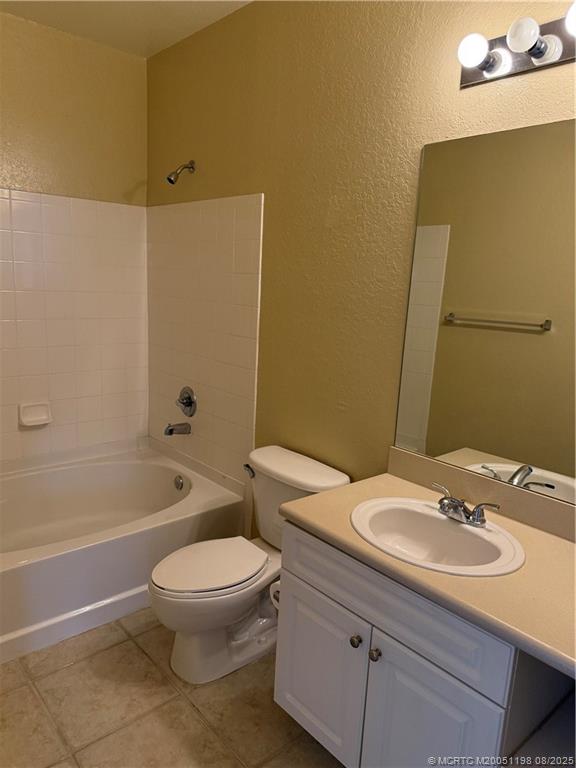 225 Southeast Kitching Circle Stuart, FL 34994 - Photo 20 of 24 a bathroom with a sink toilet and shower
