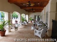 225 Southeast Kitching Circle Stuart, FL 34994 - Photo 4 of 24 a view of living room with furniture and a large window