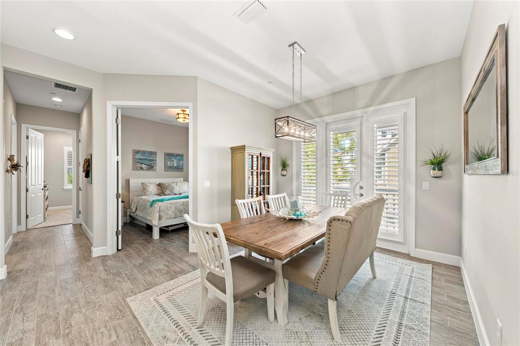 295 Compass Point Drive, Unit 202 Bradenton, FL 34209 - Photo 18 of 100 a view of a dining room with furniture window and wooden floor