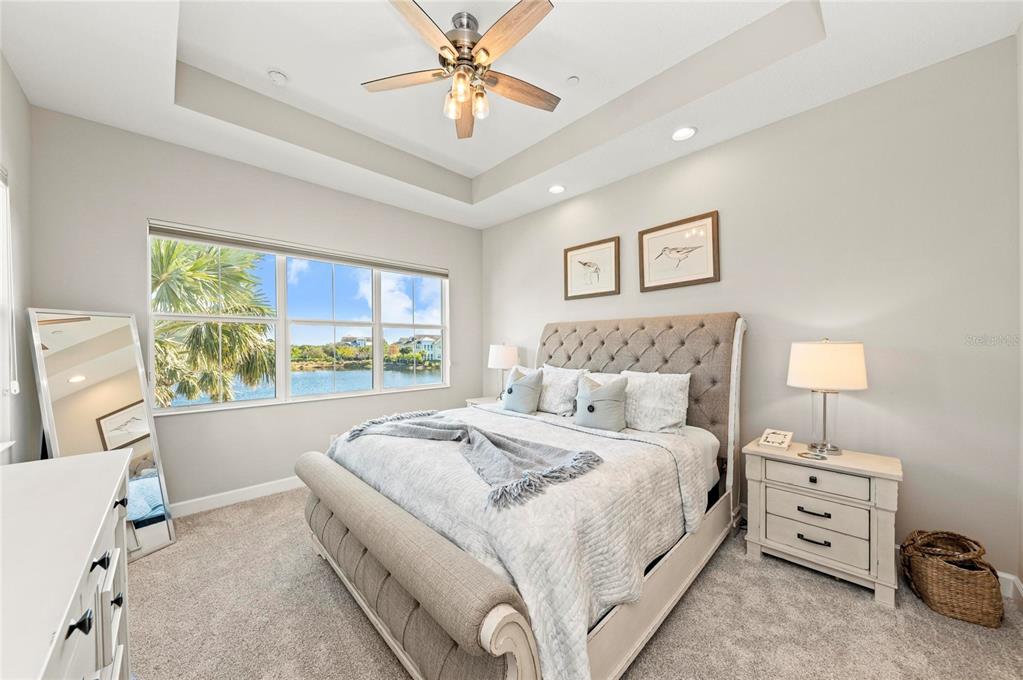 295 Compass Point Drive, Unit 202 Bradenton, FL 34209 - Photo 22 of 100 a bed room with a bed and a tv