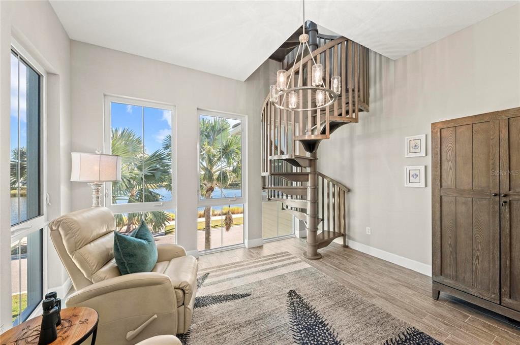 295 Compass Point Drive, Unit 202 Bradenton, FL 34209 - Photo 28 of 100 a living room with furniture and a window