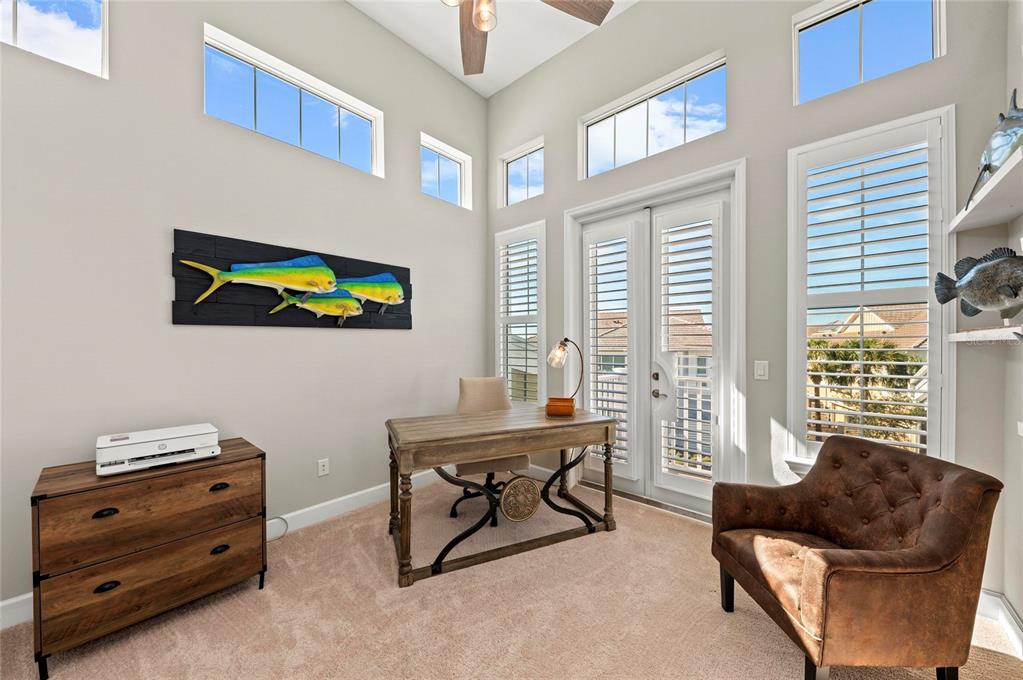 295 Compass Point Drive, Unit 202 Bradenton, FL 34209 - Photo 40 of 100 a living room with furniture and a window
