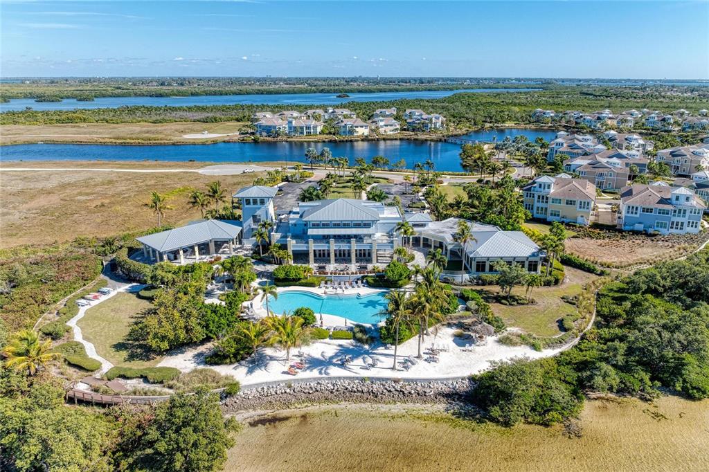 295 Compass Point Drive, Unit 202 Bradenton, FL 34209 - Photo 48 of 100 a view of a city with an ocean beach