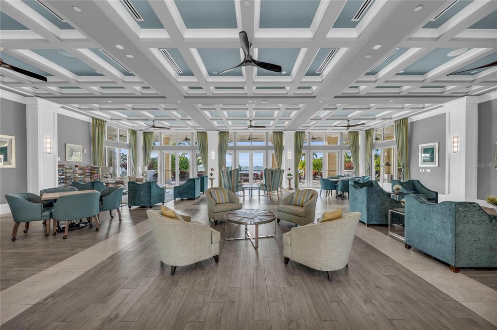 295 Compass Point Drive, Unit 202 Bradenton, FL 34209 - Photo 52 of 100 a living room with lots of furniture and hard wood flooring