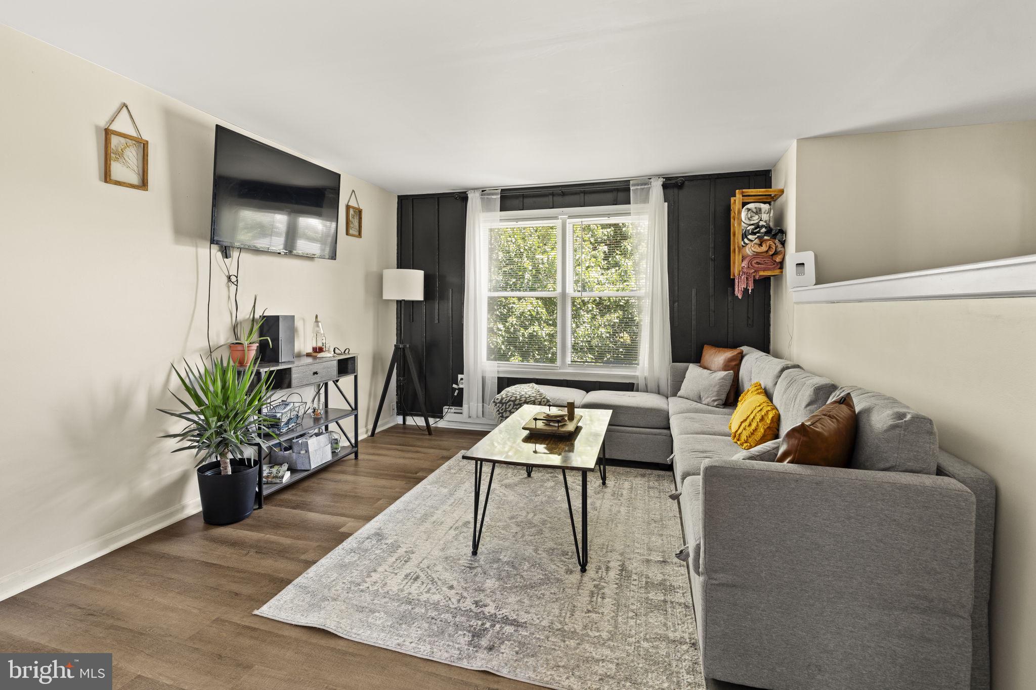 1165 Stellar Drive Mount Joy, PA 17552 - Photo 3 of 37 a living room with furniture and a flat screen tv