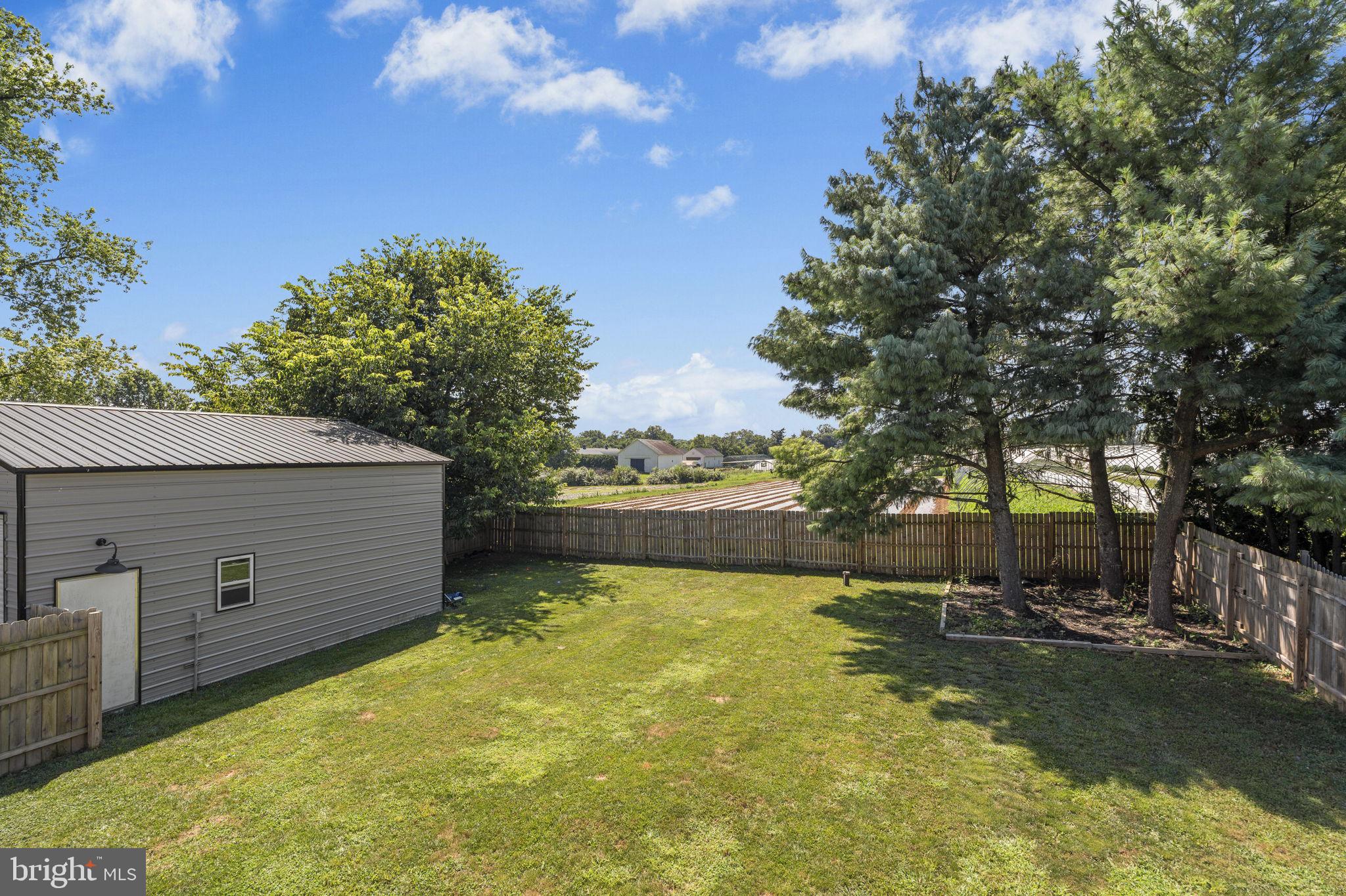 1165 Stellar Drive Mount Joy, PA 17552 - Photo 33 of 37 a view of a swimming pool with an outdoor seating and a yard
