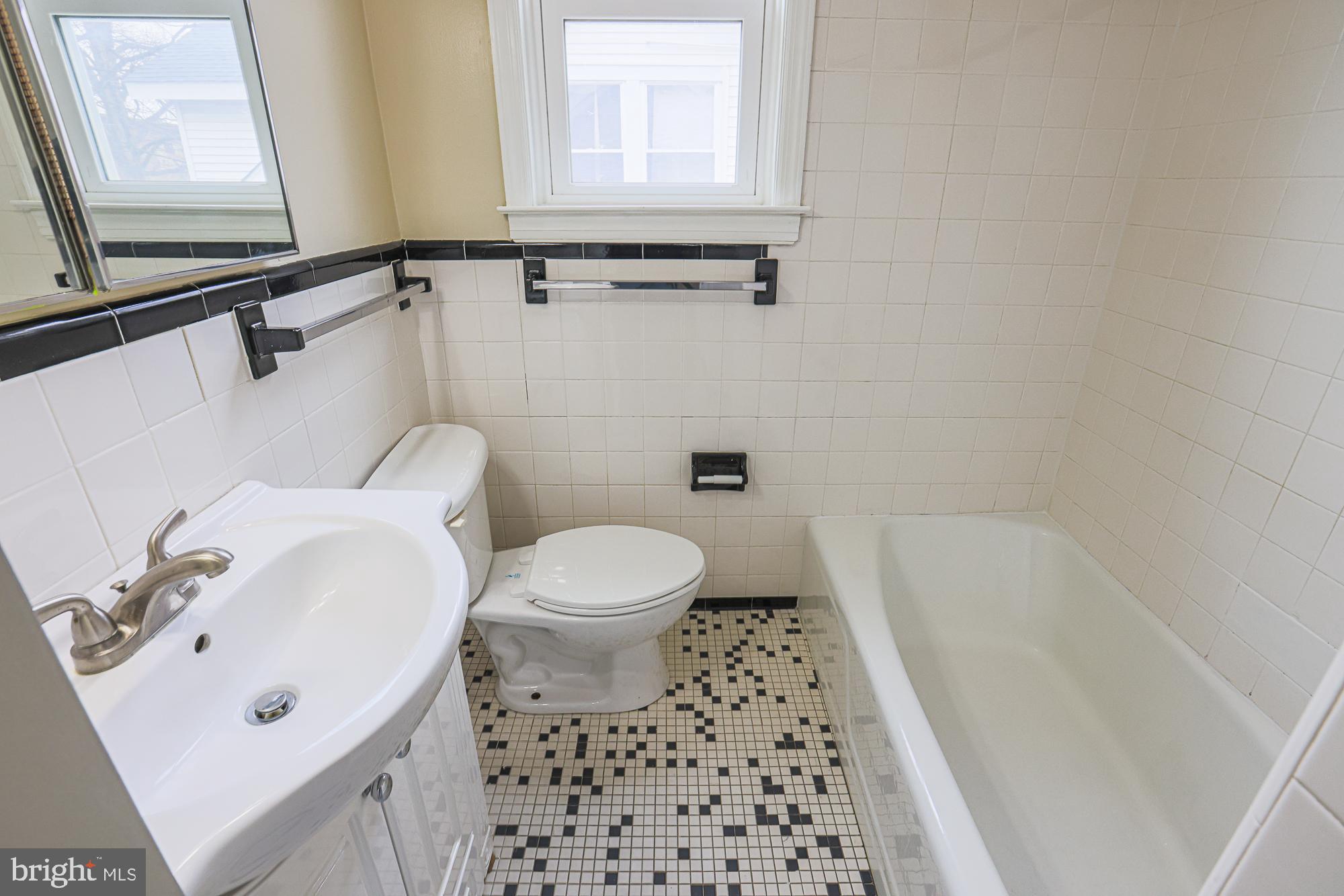 8 Irving Place Baltimore, MD 21208 - Photo 17 of 25 Charming bathroom with classic tile accents.