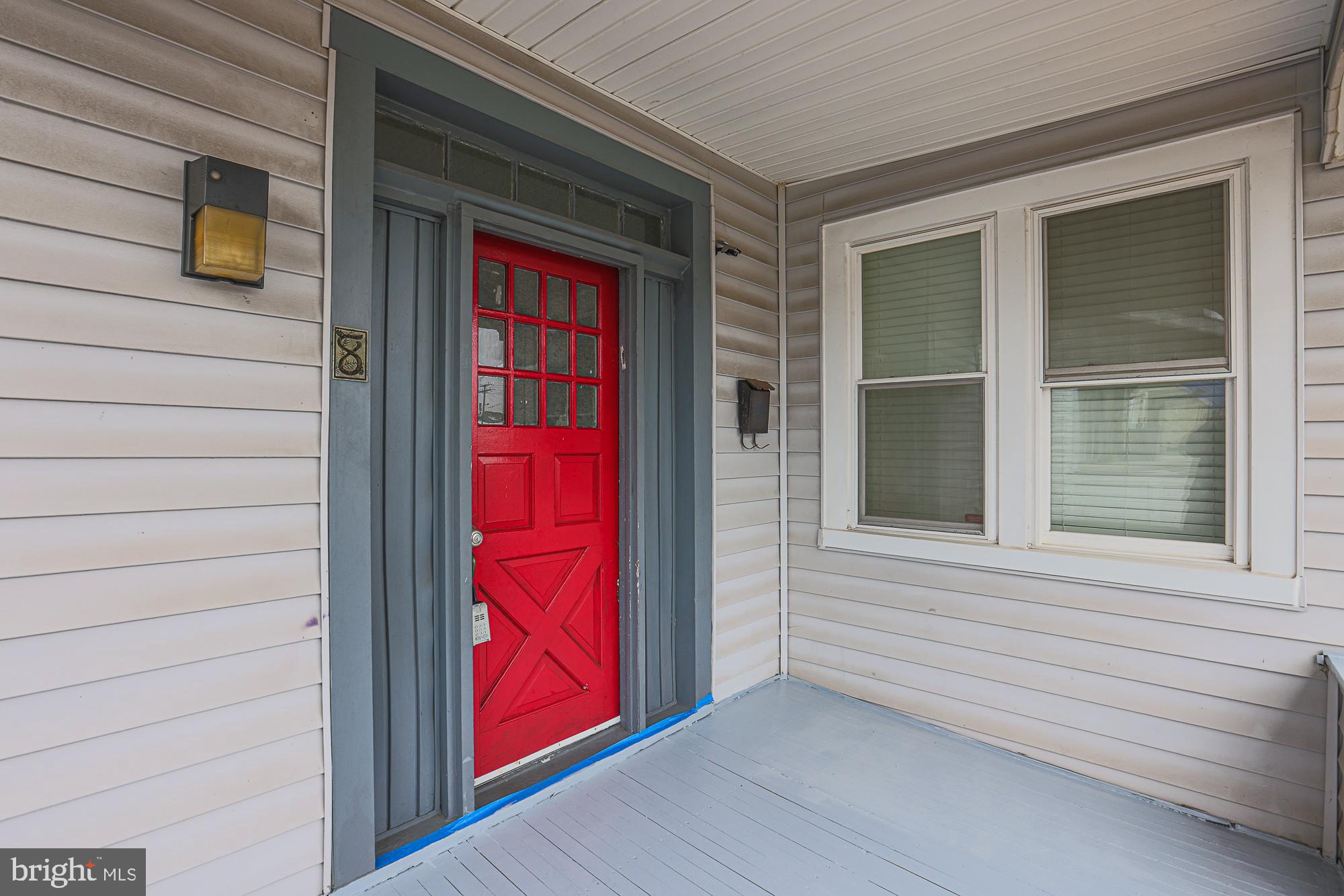 8 Irving Place Baltimore, MD 21208 - Photo 2 of 25 Charming entryway with a bold red door.
