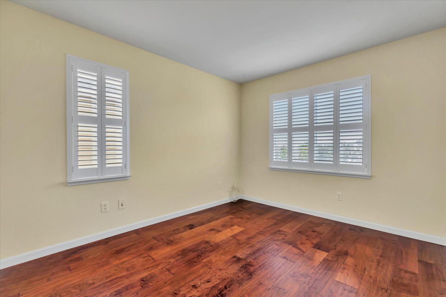 5175 Trinity Park Drive Alviso, CA 95002 - Photo 15 of 24 an empty room with wooden floor and windows