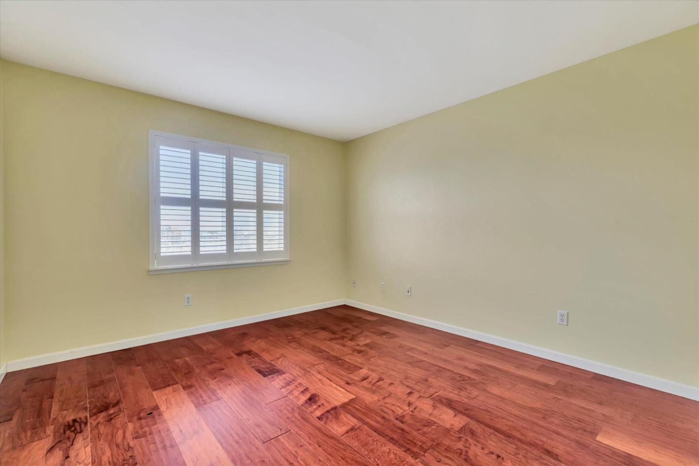 5175 Trinity Park Drive Alviso, CA 95002 - Photo 16 of 24 an empty room with wooden floor and windows