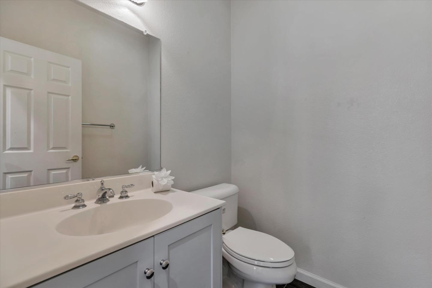 5175 Trinity Park Drive Alviso, CA 95002 - Photo 21 of 24 a bathroom with a toilet sink vanity and mirror