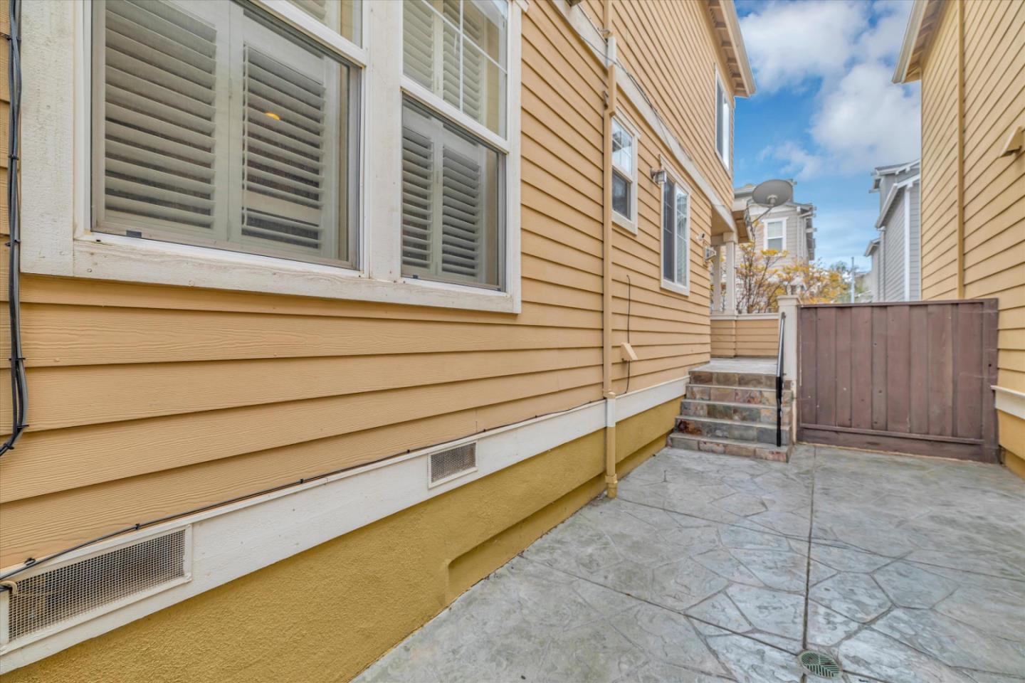 5175 Trinity Park Drive Alviso, CA 95002 - Photo 22 of 24 a view of a house with a yard and garage