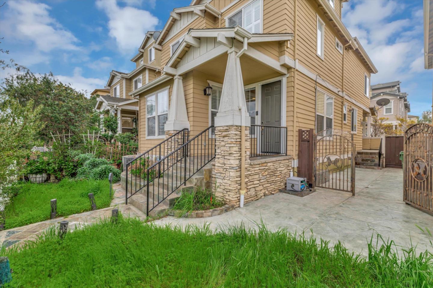 5175 Trinity Park Drive Alviso, CA 95002 - Photo 3 of 24 a view of a white house with a yard and a garden