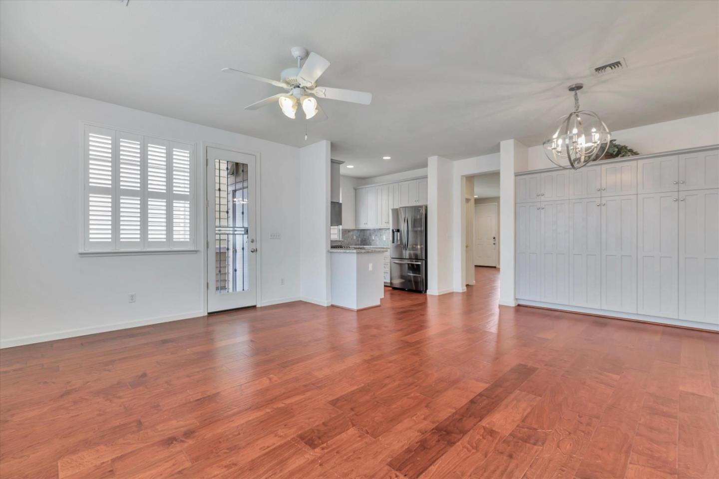 5175 Trinity Park Drive Alviso, CA 95002 - Photo 5 of 24 a view of an empty room with wooden floor and kitchen