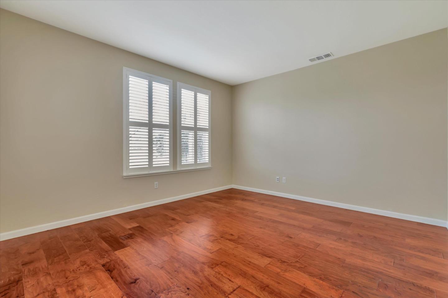 5175 Trinity Park Drive Alviso, CA 95002 - Photo 10 of 24 wooden floor in an empty room with a window