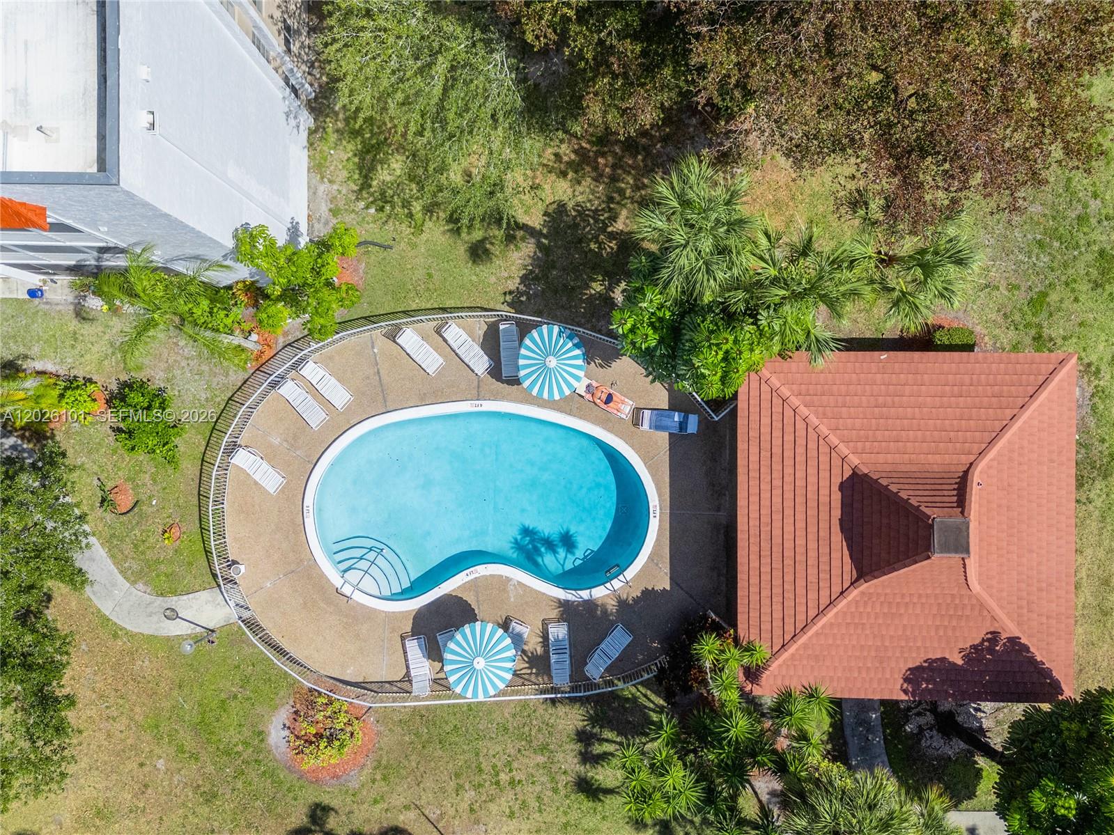 3551 Inverrary Drive, Unit 208 Lauderhill, FL 33319 - Photo 33 of 34 an aerial view of a house with outdoor space and trees all around