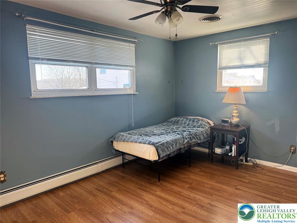 9 Jewel Street Roseto, PA 18013 - Photo 16 of 25 a bedroom with a bed window and a wooden floor