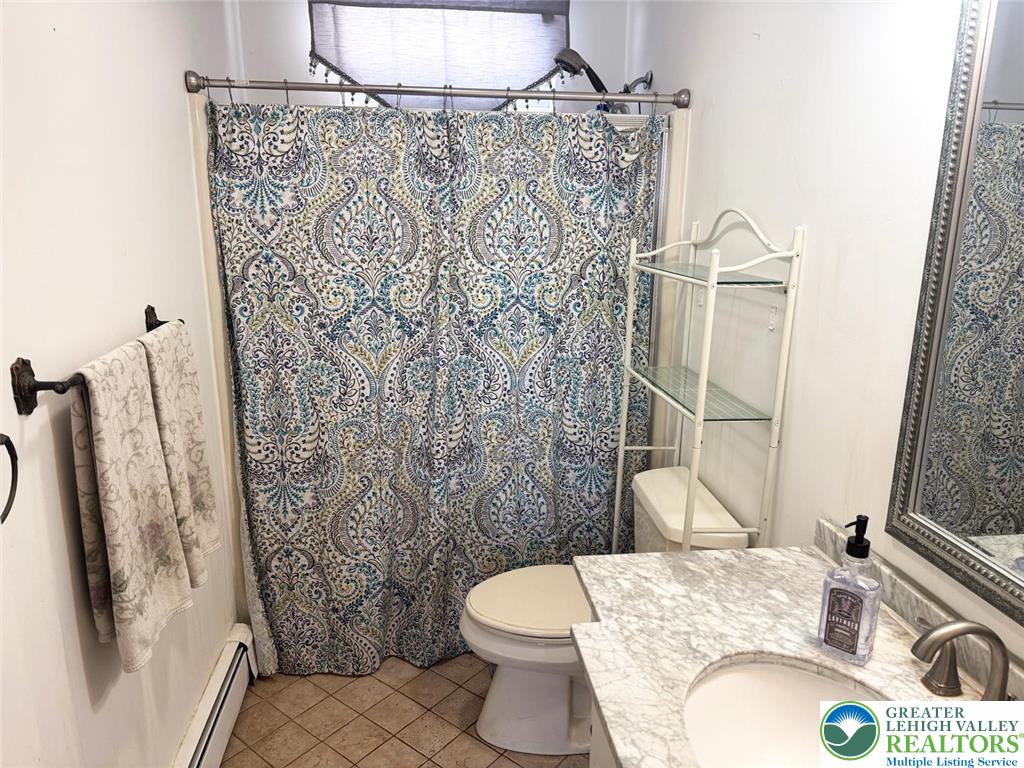 9 Jewel Street Roseto, PA 18013 - Photo 19 of 25 a bathroom with a granite countertop toilet sink and shower