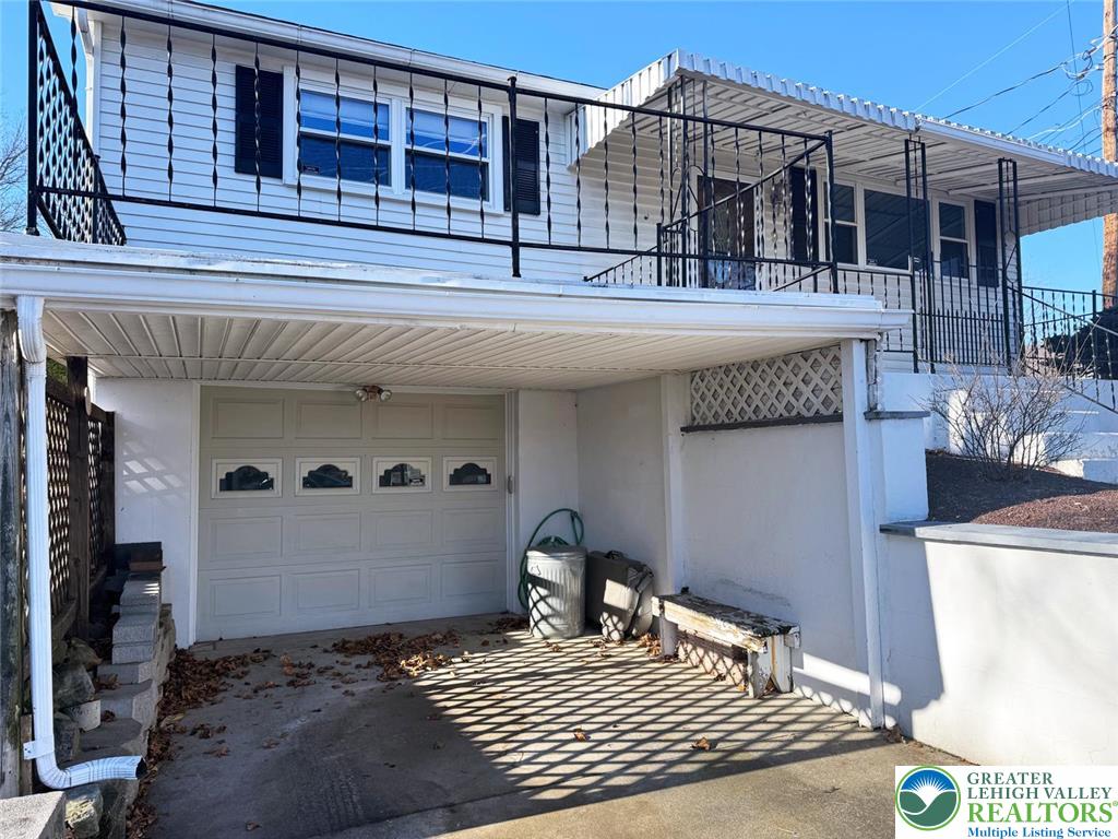 9 Jewel Street Roseto, PA 18013 - Photo 4 of 25 a view of a house with a barbeque and wooden stairs