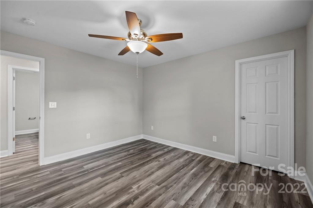3840 Turner Road Clover, SC 29710 - Photo 12 of 28 a view of an empty room with wooden floor