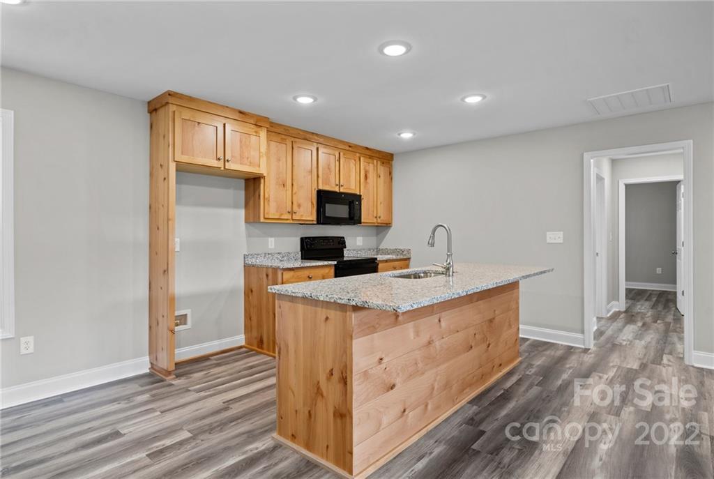 3840 Turner Road Clover, SC 29710 - Photo 22 of 28 a view of kitchen with sink microwave and refrigerator