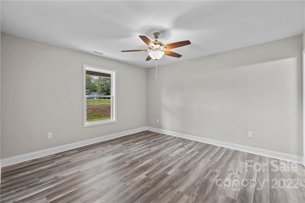 3840 Turner Road Clover, SC 29710 - Photo 25 of 28 wooden floor in an empty room with a window