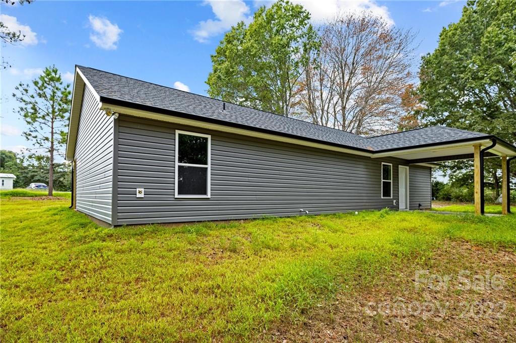3840 Turner Road Clover, SC 29710 - Photo 27 of 28 a backyard of a house with table and chairs