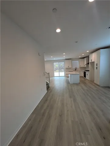 a bathroom with a sink a toilet a mirror and vanity