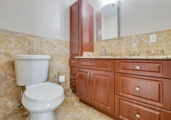 a bathroom with a toilet and a sink