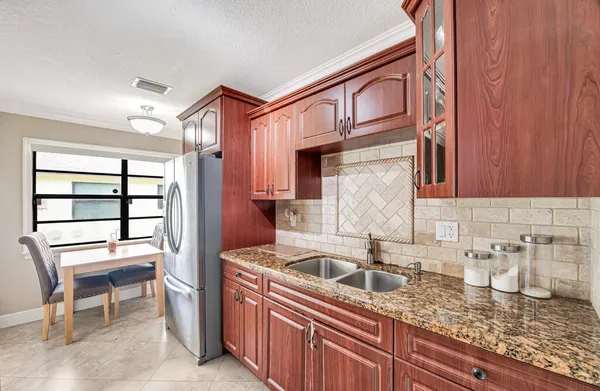 a kitchen that has a sink and a cabinets