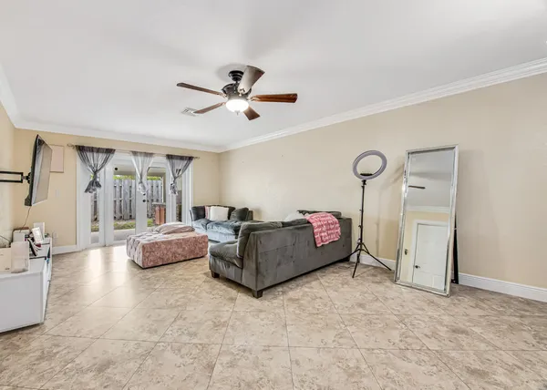 a living room with furniture and a large window