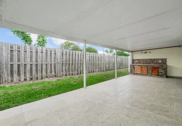 a view of backyard and tree