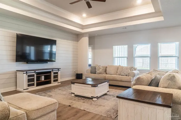 a living room with furniture and a flat screen tv