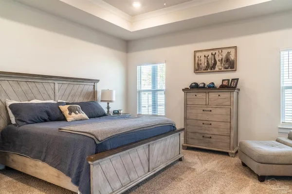 a bedroom with a bed and a dresser