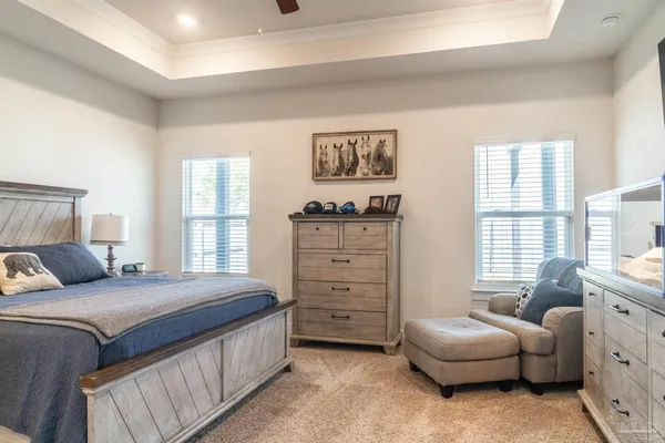 a bedroom with a bed and a couch