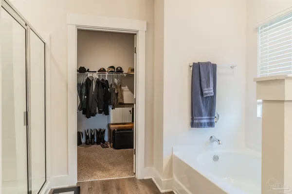 a bathroom with a bathtub and a shower