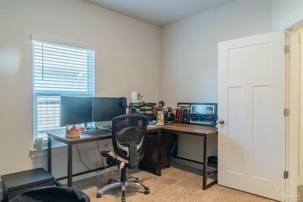a kitchen with a sink a stove and cabinets