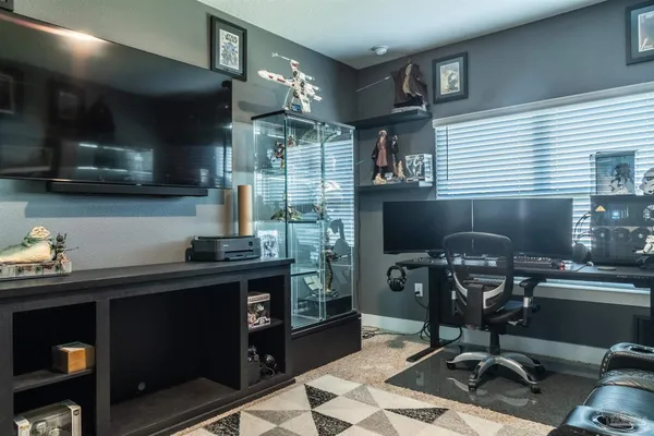 a bedroom with bed and a window