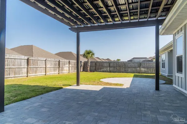 a view of a house with swimming pool and a yard
