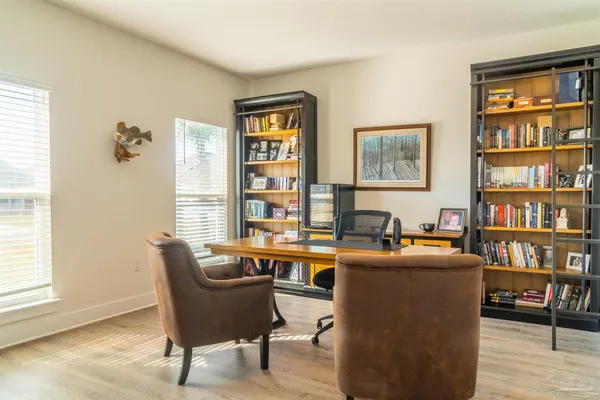a dining room with furniture and window