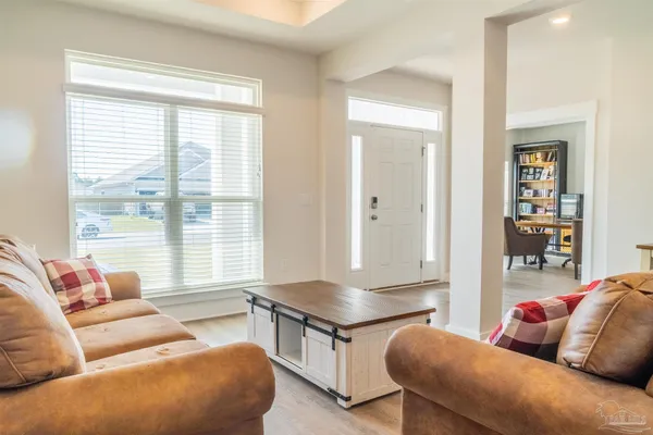 a living room with furniture and a window