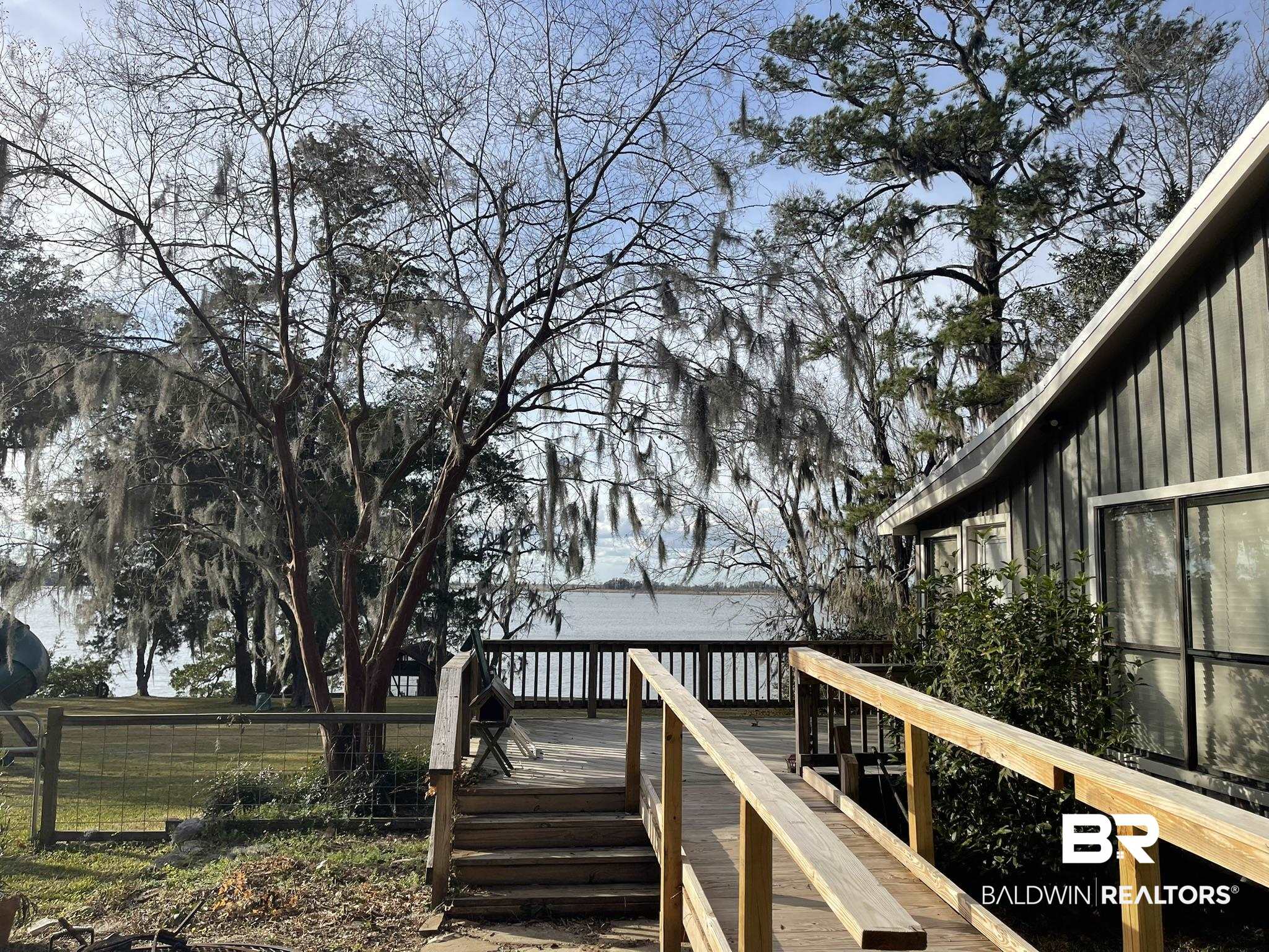 6621 Purvis Road Daphne, AL 36527 - Photo 6 of 59 View of wooden deck
