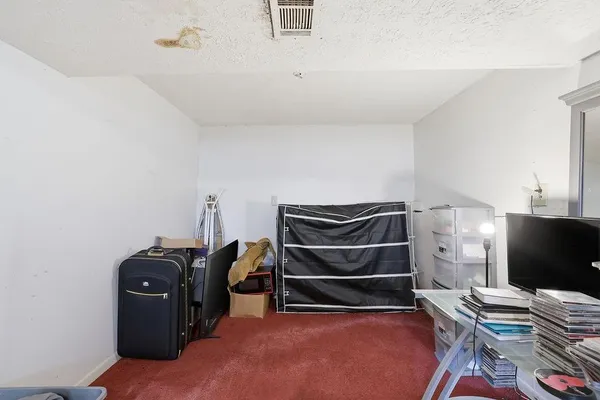 a room with a closet and wooden floor